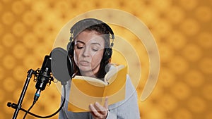 Woman reading book to record audiobook, leaving studio after finishing