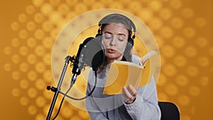 Woman reading book to record audiobook, leaving studio after finishing