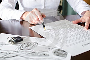 Woman reading a car purchase contract