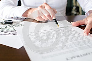 Woman reading a car purchase contract