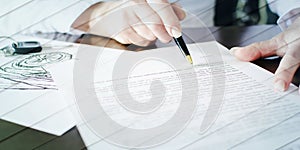 Woman reading a car purchase contract, geometric pattern