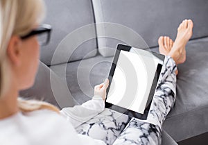 Woman reading ebook on tablet computer