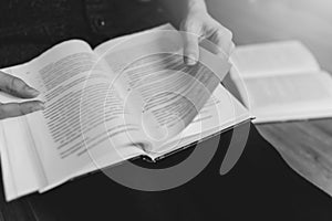 Woman reading a few books indoor