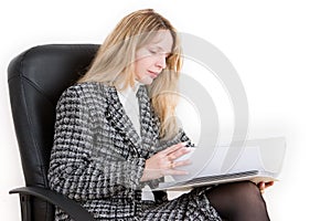 A woman reading a file