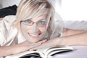 Woman reading with glasses