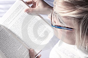 Woman reading with glasses