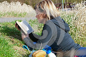 Woman Reading on Grass