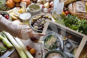 Woman reading healthy foods recipe on a tablet