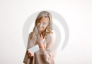Woman reading a heartfelt message note or card