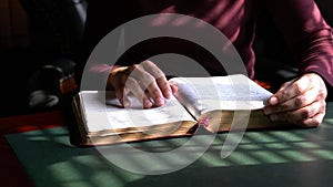 Woman reading her bible, closeup view.