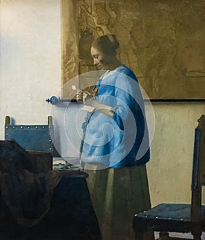 Woman reading a letter, painting by Johannes Vermeer