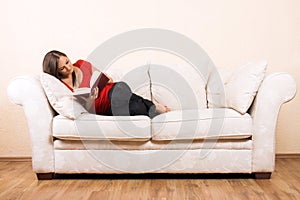 Woman is reading on a lounge