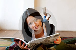 Woman is reading the magazine