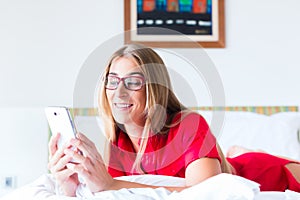 Woman reading Mails on smartphone