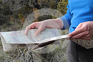 Woman reading map for navigation