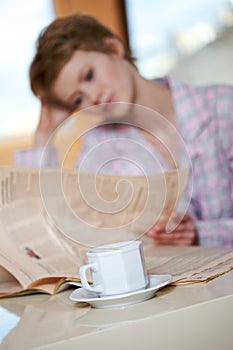 Woman reading newspaper