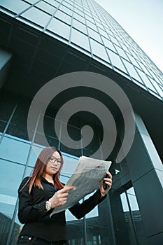 Woman reading newspaper