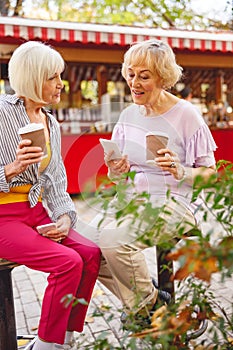 Woman reading out loud to her friend