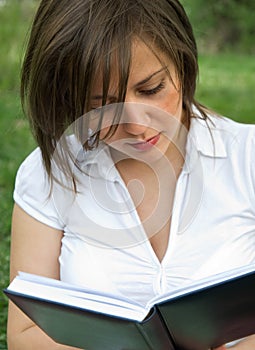 Woman reading outdoors