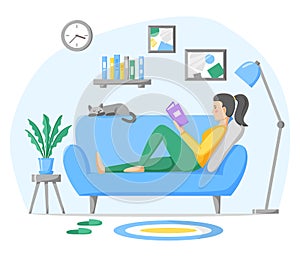 Woman reading paper book on sofa at home. Living room interior with couch, home plant and pet. Rest and leisure time at