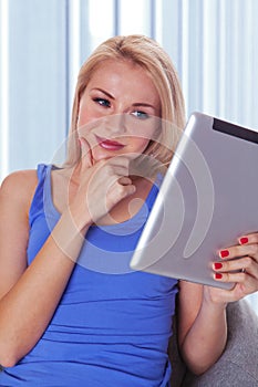 Woman reading a tablet computer