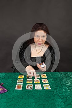 A woman is reading tarot cards