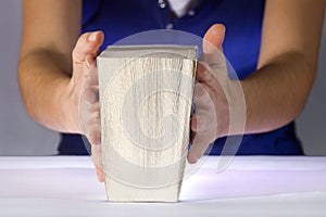 Woman reading a thick book