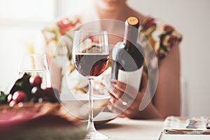 Woman reading a wine label