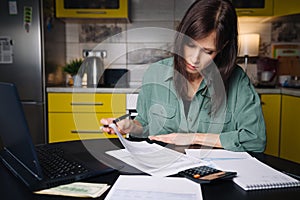 Woman Reads Irs Us Individual Income Tax Form 1040 in tax time