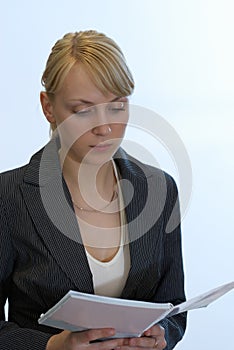 Woman reads a writing-book