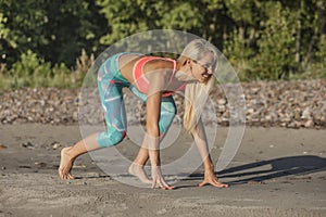 Woman ready for running by the sea on beach