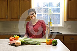 Woman ready to cook in kitchen