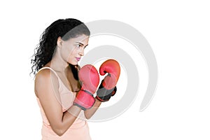 Woman ready to fight while wears boxing gloves