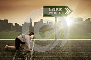 Woman ready to lose weight concept