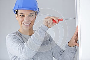 woman ready to use screwdriver and pliers