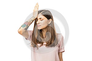 Woman Realizing Mistake And Keeping Hand On Head
