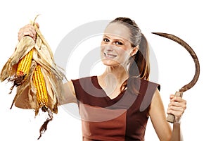 Woman with reaping hook and corn photo