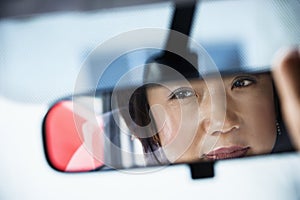 Woman in rearview mirror