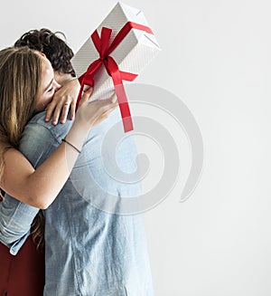 Woman receive a gift box from her lover photo