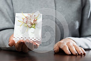 woman received beautiful postcard. Symbol of holiday, affection,