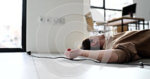 Woman received electric shock when disconnected from mains and lies on floor