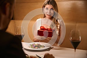 Woman received a surprise from her companion during romantic dinner