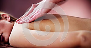 Woman Receiving Back Massage From Therapist