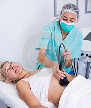 Woman receiving cryoliposuction