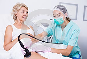 Woman receiving cryoliposuction