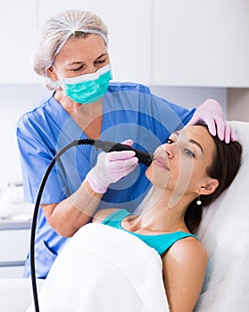 Woman receiving cryoliposuction