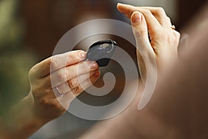 Woman receiving door key in hotel front desk