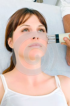 Woman receiving electrostimulation