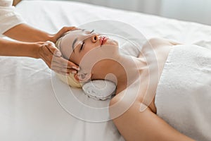 Woman Receiving Facial Massage at Luxury Spa