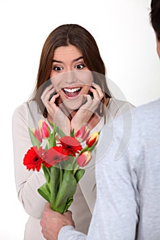 Woman receiving flowers from her boyfriend